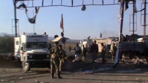 Yemeni soldiers inspect the site were a suicide car bomb killed 11 soldiers in the city of Saba in central Yemen. (AFP PHOTO/STR)