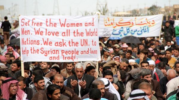 Iraqi protestors gather during a demonstration in the city of Samarra on March 8, 2013. Protestors have taken to the streets in Sunni-majority areas for more than two months, calling for the resignation of Prime Minister Nouri al-Maliki. (AFP PHOTO / MAHMOUD AL-SAMARRAI)