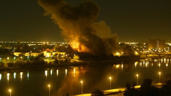 File picture dated March 20, 2003 shows smoke billowing after a missile hit the planning ministry in Baghdad as the Iraqi capital came under heavy US-led bombardment on the first day of the US-led invasion of Iraq that toppled Saddam Hussein. (AFP PHOTO/Ramzi HAIDAR)