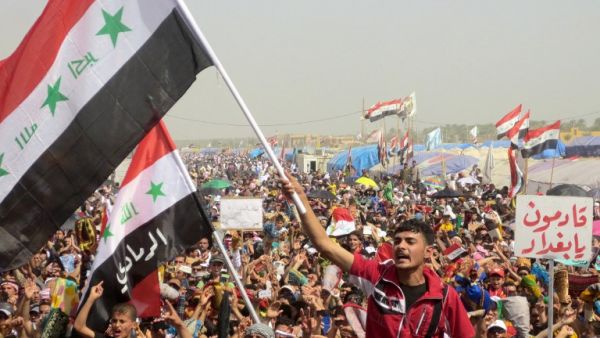 Iraqi demonstrators shout slogans during an anti-government protest in the western city of Ramadi on Friday. (AFP PHOTO/AZHAR SHALLAL)