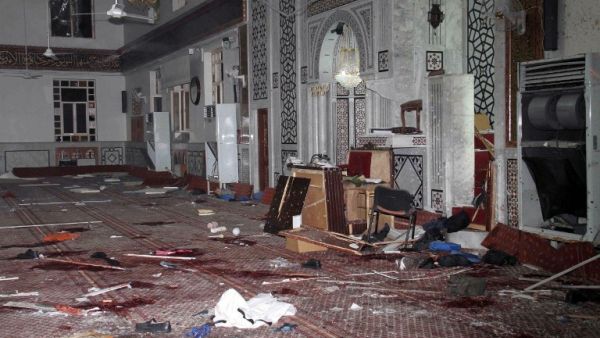 An image made available by the Syrian Arab News Agency (SANA), shows remains and the carpeted floor covered with blood inside of the Iman Mosque in the Mazraa neighborhood of the Syrian capital Damascus. (AFP PHOTO /HO-SANA) 