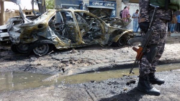 An Iraqi soldier stands on the scene of a car bombing on May 30 in the Iraqi capital, Baghdad. Iraq has seen a huge increase in violence over the past few months. AFP image