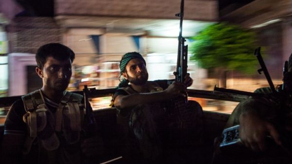 Syrian rebels head to the town of Bsankol in the northwestern province of Idlib to join comrades fighting regime forces for the control of the highway that connects Idlib with Latakia on July 11, 2013. (AFP PHOTO/DANIEL LEAL-OLIVAS)