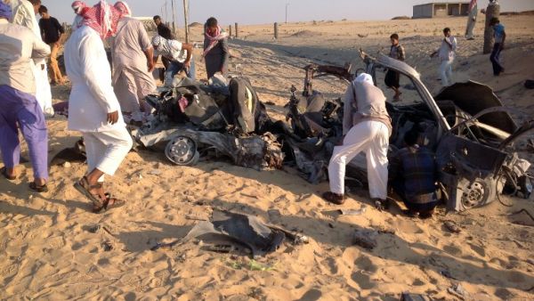 Egyptians gather near a damaged car bomb that exploded before reaching the intended target, killing three passengers on July 24, 2013 in El-Arish, in Egypt's Sinai peninsula. (AFP)