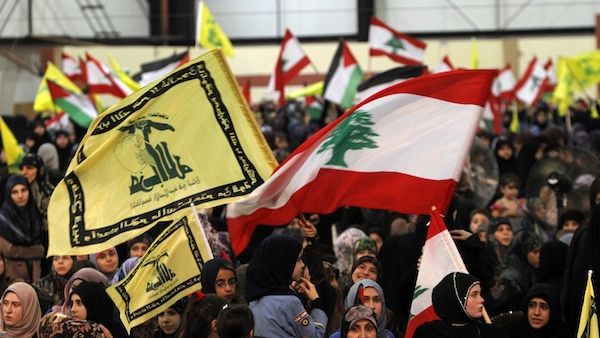 ebanese women loyal to Hezbollah wave the national flag and Hezbollah flags during a gathering to mark the "Al-Quds (Jerusalem) International Day" from Beirut's southern suburb neighbourhood of Rweiss on August 2, 2013. (AFP) ebanese women loyal to Hezbollah wave the national flag and Hezbollah flags during a gathering to mark the "Al-Quds (Jerusalem) International Day" from Beirut's southern suburb neighbourhood of Rweiss on August 2, 2013. (AFP)