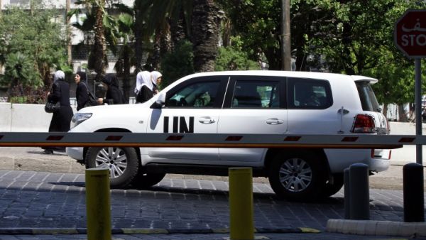 The UN chemical weapons investigation team arrives in Damascus on August 18, 2013. (AFP)