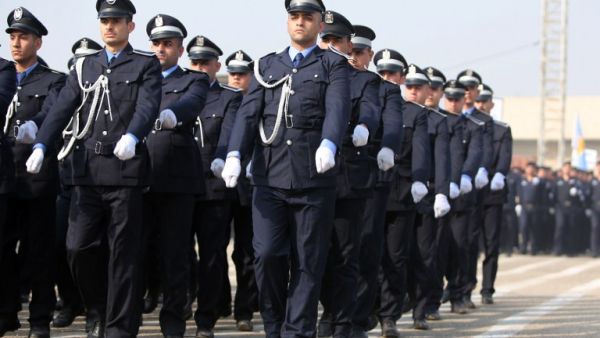 Iraqi policemen march during a ceremony marking police forces 92nd anniversary in the capital Baghdad on January 9, 2014. [AFP]