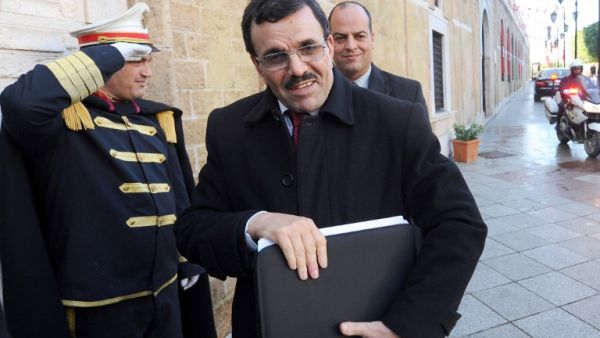 Tunisia's Islamist premier Ali Larayedh arrives at Kasbah Palace in Tunis to submit his resignation to Tunisian President Moncef Marzouki on January 9, 2014.  [AFP]
