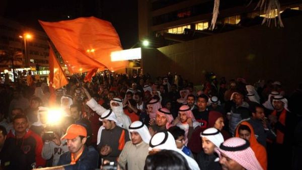 Kuwaiti opposition supporters demonstrate in downtown Kuwait City late on Saturday night, to demand dissolution of the new parliament. (AFP PHOTO/YASSER AL-ZAYYAT)