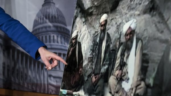 US Senator Kelly Ayotte points to a photo of Sulaiman Abu Ghaith (L) during a press conference on Capitol Hill in Washington, DC. (AFP PHOTO/Brendan SMIALOWSKI)