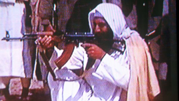 OBL had weapons within reach but reports do not yet clarify whether he reached for them before he was shot.