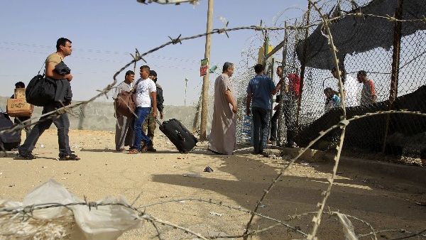 Palestinian travellers gather at the Rafah crossing with Egypt in the southern Gaza Strip on Friday after Egypt closed its borders. AFP Photo 