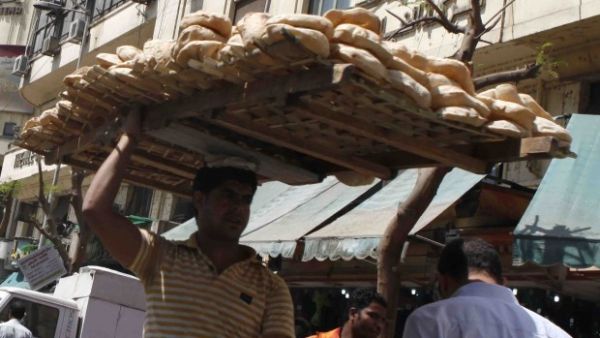 Street vendor distributing bread in Egypt