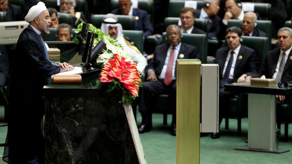 Iran's President Hasan Rowhani (L) delivers a speech after being sworn in before parliament in Tehran on August 4, 2013. (AFP)