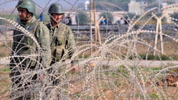 Turkish soldiers patrol in the Turkish town of Ceylanpinar near the strategic Syrian border town of Ras al-Ain late last year (BULENT KILIC/AFP)