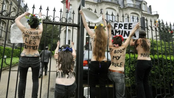 FEMEN activists protest outside the Tunisian embassy in Brussels on Thursday after three of their  bare-breasted companions get jailed in Tunis.