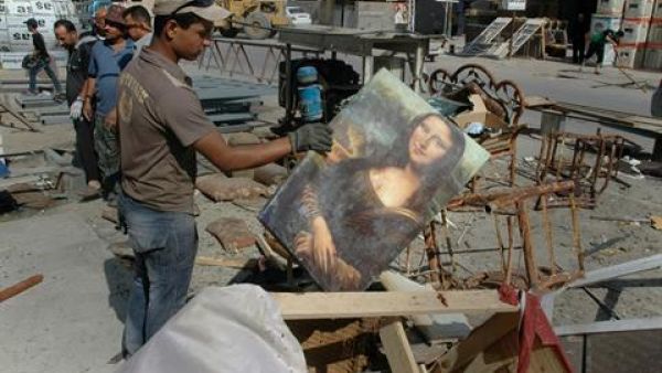 hree bomb attacks in Iraq including a blast inside a roadside restaurant killed 12 people on Monday, officials said, the latest in a surge of violence that has left nearly 2,000 dead since the beginning of April.