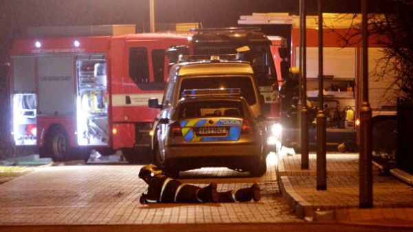 Firefighters work outside the residence of the late Palestinian ambassador Jamal al-Jamal on January 1, 2014 in Prague, Czech Republic. [Getty Images]