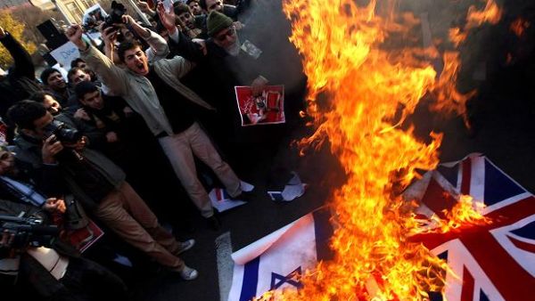 Angry protestors in Tehran stormed the British embassy two years ago causing the two countries to sever ties (Getty) Angry protestors in Tehran stormed the British embassy two years ago causing the two countries to sever ties (Getty)