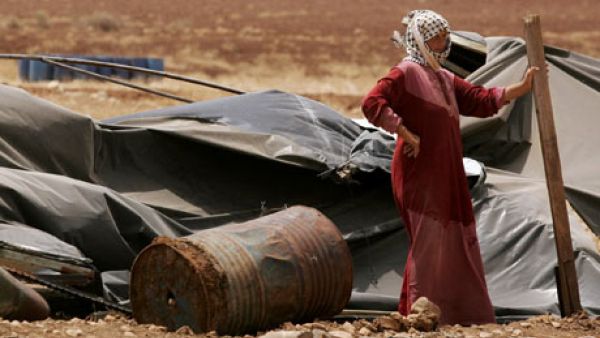 A Palestinian bedouin woman stands next to her destroyed tent in the village of Atouf in the Jordan Valley (AFP/File)
A Palestinian bedouin woman stands next to her destroyed tent in the village of Atouf in the Jordan Valley (AFP/File)