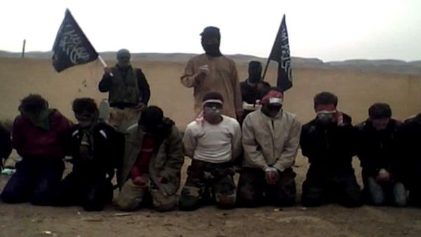 A screenshot from the video in which Al Nusra fighters execute men in rural Syria. Acts such as this have lead the US to call its leader Mohammad Al Golani a terrorist. AFP/YouTube image. 