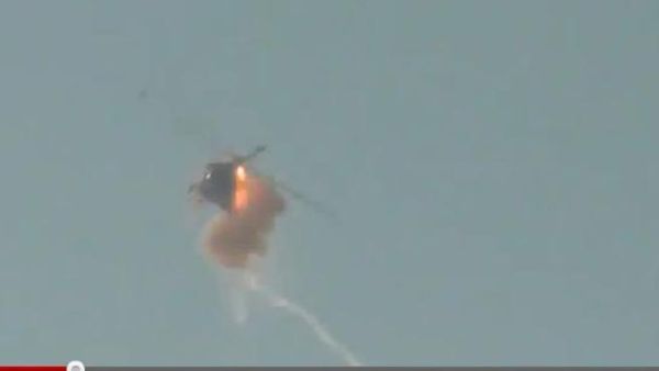 Screenshot from the video appearing to show a helicopter shot down in Aleppo