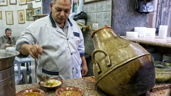 Just about everything at Hashem Restaurant exudes the grittiness of this city's rough-and-tumble downtown: chefs in white aprons
scoop fuul (fava beans) out of vase-shaped metal jars and plop it on to plastic bowls.
