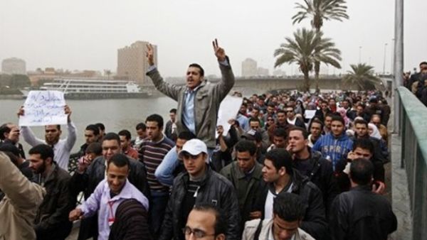 Jobless youth in Cairo protest as unemployment rates increase across the region (Hussein Malla/AP)