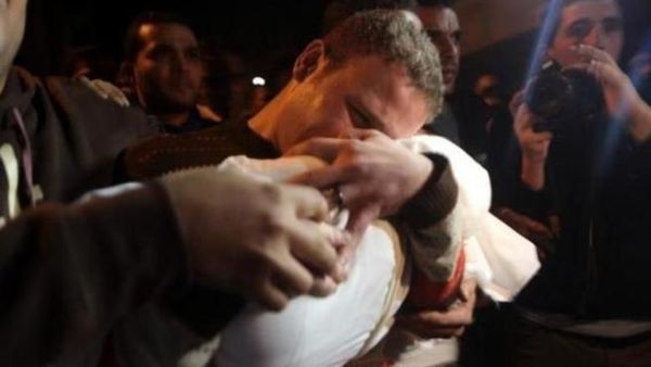 BBC cameraman, Jihad Misharawi cradles dead son, Omar
