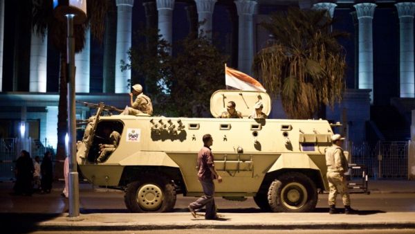 An Egyptian army armoured vehicle is seen in front of the Supreme Constitutional Court in Cairo ahead of planned demonstrations on August 18, 2013. (AFP)