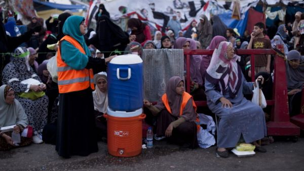 Supporters of deposed Egyptian President Mohammed Morsi wait prior to the 'iftar' fast-breaking meal at a sit-in protest at the Rabaa al Adweya Mosque in the Nasr City district on July 28, 2013 in Cairo. (Getty images)