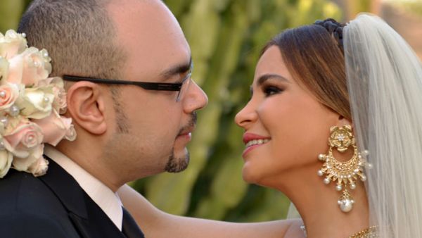 The happy couple: Waleed Mustafa and Carole Samaha on their wedding day. (Image: Facebook)