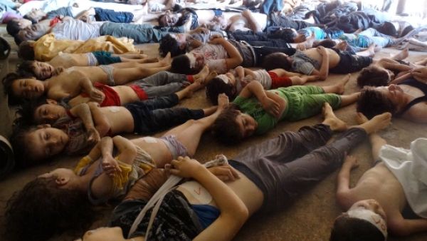Bodies of children and adults are laid on the ground as Syrian rebels claim they were killed in a toxic gas attack by pro-government forces in eastern Ghouta, on the outskirts of Damascus on August 21, 201(AFP/HO/Shaams News Network)