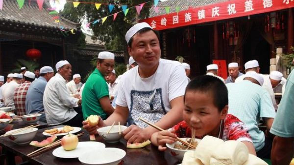 China is home to thousands of Muslims - some estimate that 1-2% of the population believe in Islam. Here, a Chinese Muslim and his son celebrate the first day of Eid Al Adha in 2013 in the east of China. (AFP/File)