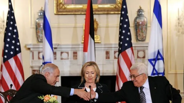 2010 US Secretary of State Hillary Clinton (C), looks on as Prime Minister Benjamin Netanyahu of Israel (L) and President Mahmoud Abbas of the Palestinian Authority (R) shakes hands as they re-launch of direct negotiations between Israeli and Palestinian Authority at the State Department in Washington, DC, on September 2, 2010