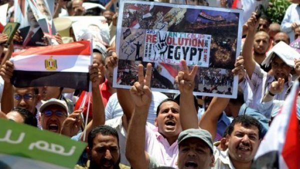 Supporters of Egypt's ousted president Mohamed Morsi take part in a demonstration in Alexandria, Egypt, on July 26, 2013 (AFP)