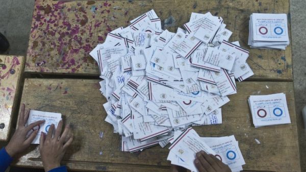 The announcement that the new Egyptian constitution was approved by  98.1 percent of voters has raised some eyebrows. (AFP)
