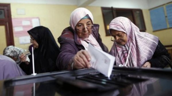 Egyptian women cast their votes in Cairo, for the referendum, 2012