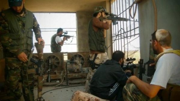AFP PHOTO / HO / SHAAM NEWS NETWORK: The FSA in Damascus