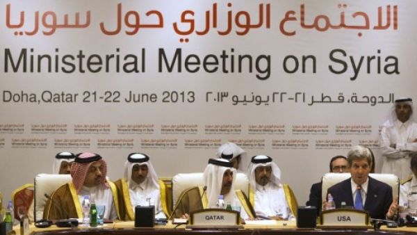  Qatari acting minister of business and trade, and Qatari Prime Minister and Foreign Minister Hamad bin Jassim bin Jaber al-Thani, listen as U.S. Secretary of State John Kerry as he speaks during a Friends of Syria meeting in Doha on Saturday. (AFP)