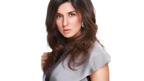 Busy mamma Ghada Adel cut her family vacation short to return to Egypt. (Image: Facebook)