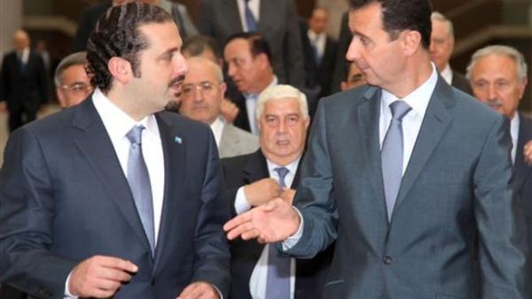 Former Lebanon Prime Minister Saad Hariri with Syrian President Bashar al-Assad.