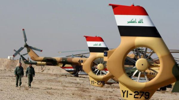 Four members of the Egyptian security forces were killed on Wednesday after the helicopter they were flying in was shot down by insurgents during a military training exercise north of Baghdad. (AFP/File)