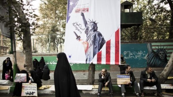 A UN official speaking at the P5+1 Geneva conference said the world powers are considering temporarily suspending their sanctions against Iran in exchange for a halt in its nuclear program (AFP)
