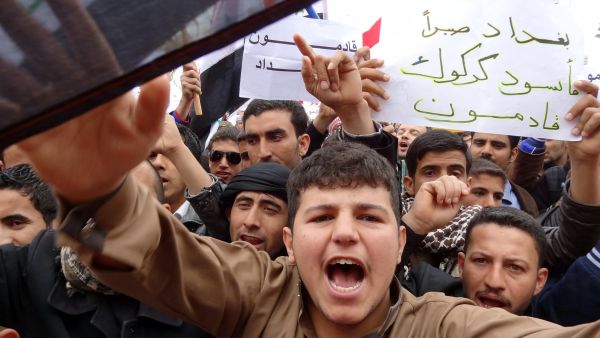 Iraqis shout slogans during an anti-government protest at the end of Friday prayers in the ethnically mixed city of Kirkuk,  north of Baghdad. Thousands of people in Sunni-majority areas of Iraq called for the government's fall amid a spike in violence that has accompanied a political stalemate two months before provincial polls. (AFP Photo/Marwan Ibrahim)