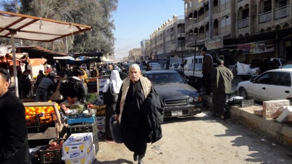 Despite the chaos engulfing Anbar province, life must go on as normal for many residents. Here, Iraqi traders sell their goods at an open air market in the center of the city of Fallujah, west of the capital Baghdad on January 8, 2014 (AFP)