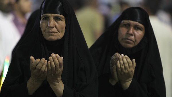 Muslim Shiites women pray during the ceremony commemorating the birth of Imam Mehdi, the 12th holiest figure for Shiite Muslims. in Karbala on Monday. Several bombs targeted Shiites on Monday evening, as sectarian violence grows. (AFP)