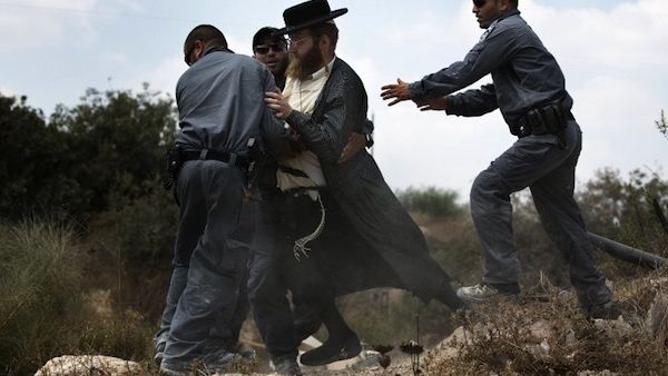Extremist right-wing settlers from Yitzhar clashed with Israeli security forces over the destruction of illegally built homes. (AFP/File) Extremist right-wing settlers from Yitzhar clashed with Israeli security forces over the destruction of illegally built homes. (AFP/File)