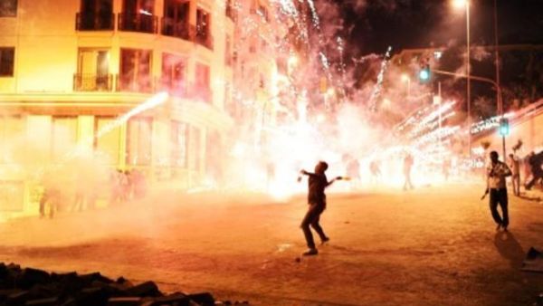 Protesters clash with Turkish riot policemen on the way to Taksim Square in Istanbul on Wednesday. AFP Photo