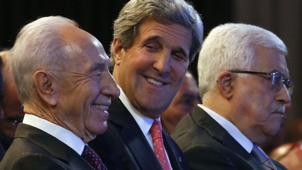 US Secretary of State John Kerry sits between Palestinian President Mahmoud Abbas and Israeli President Shimon Peres. Kerry says both sides are remaining 'steadfast' in the negotiations. (AFP/File)